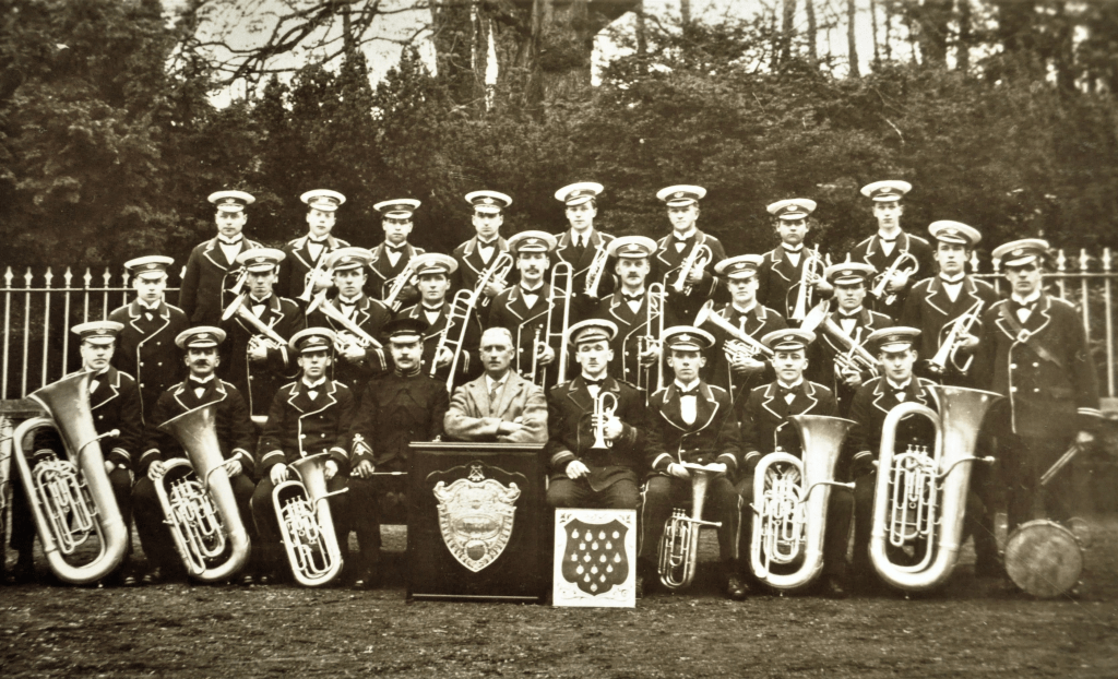 Darvel Burgh Band pictured with instruments and trophies in 1922.
