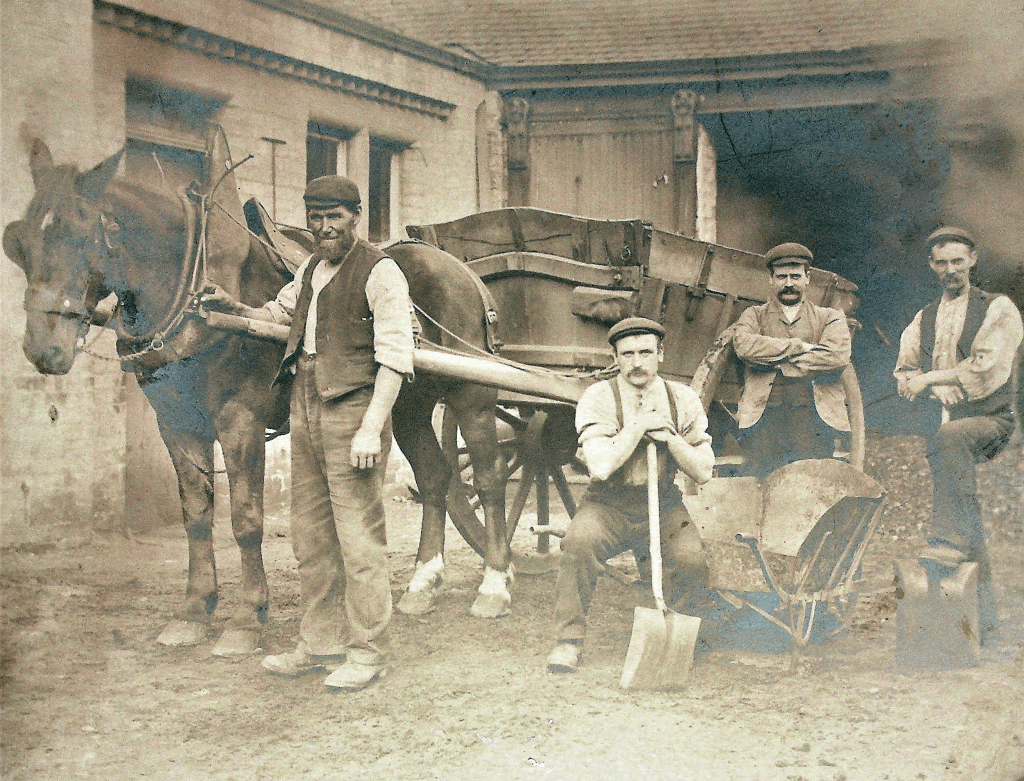 Unidentified workmen with a horse, possibly behind the old Co-op building. Date unknown.
