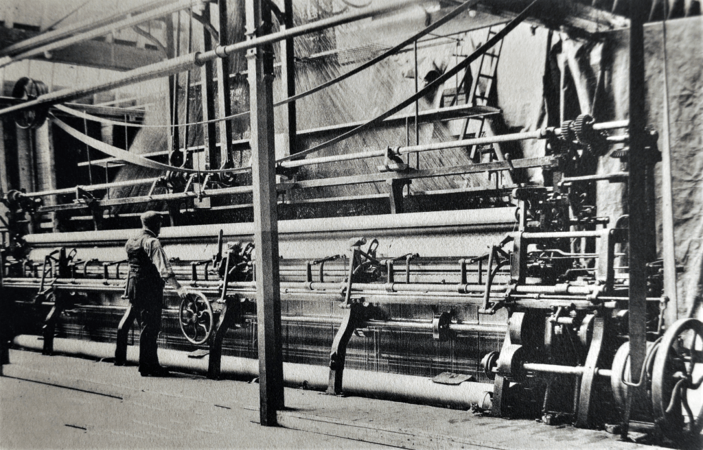 Lace curtains being woven in a Darvel textile works. Date unknown.